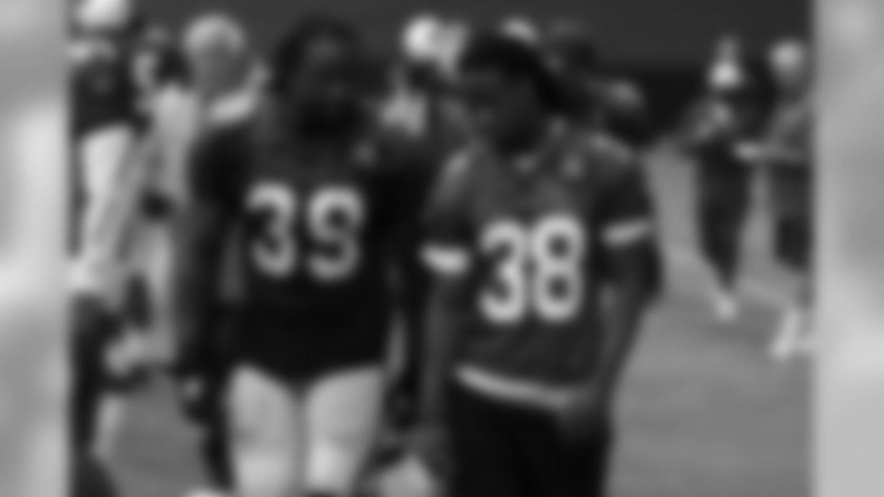 RB Robert Hughes (left) and RB Andre Ellington