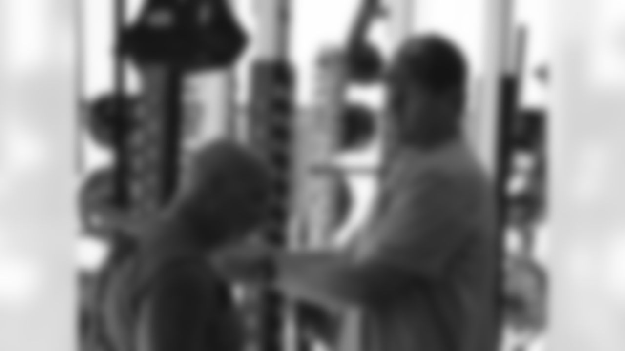 QB Carson Palmer (right) with strength and conditioning coach Buddy Morris