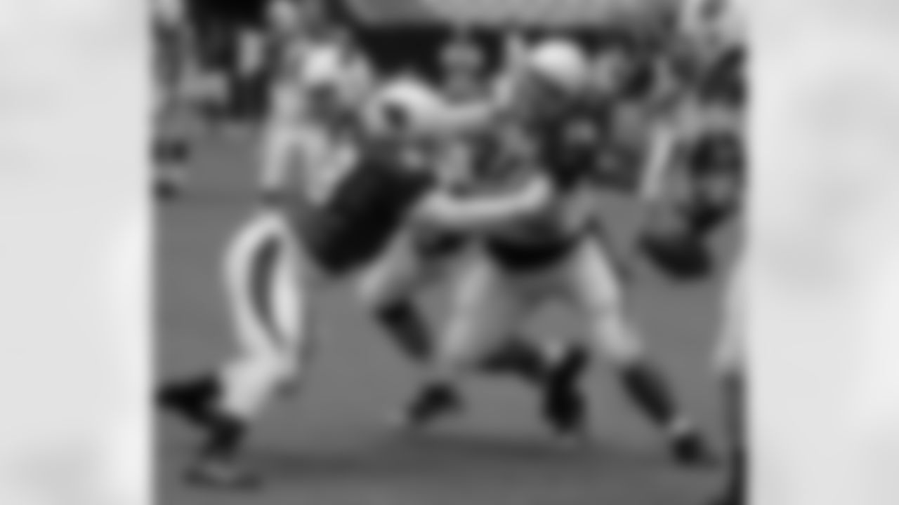 DE Frostee Rucker gets up in the face of G Paul Fanaika