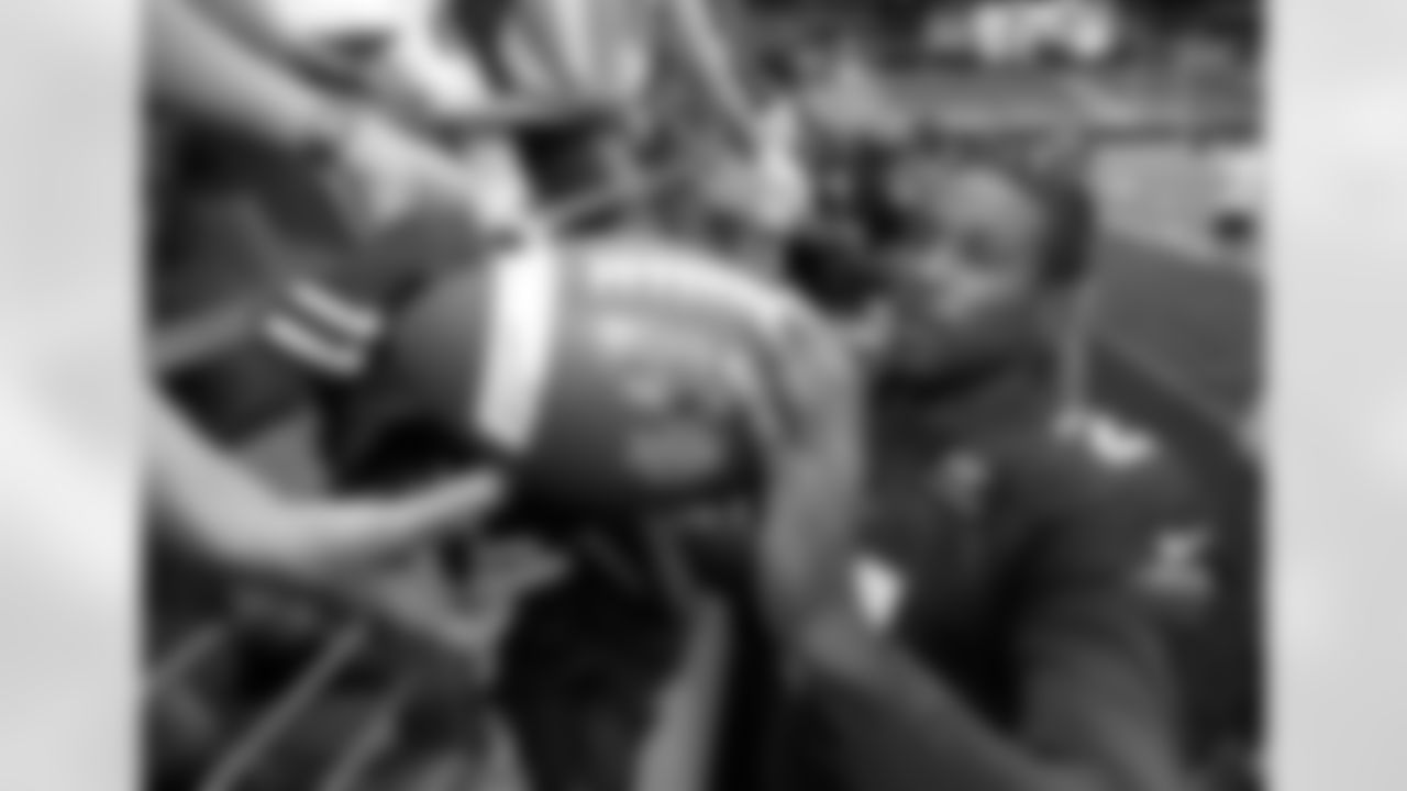 Signing an autograph in training camp