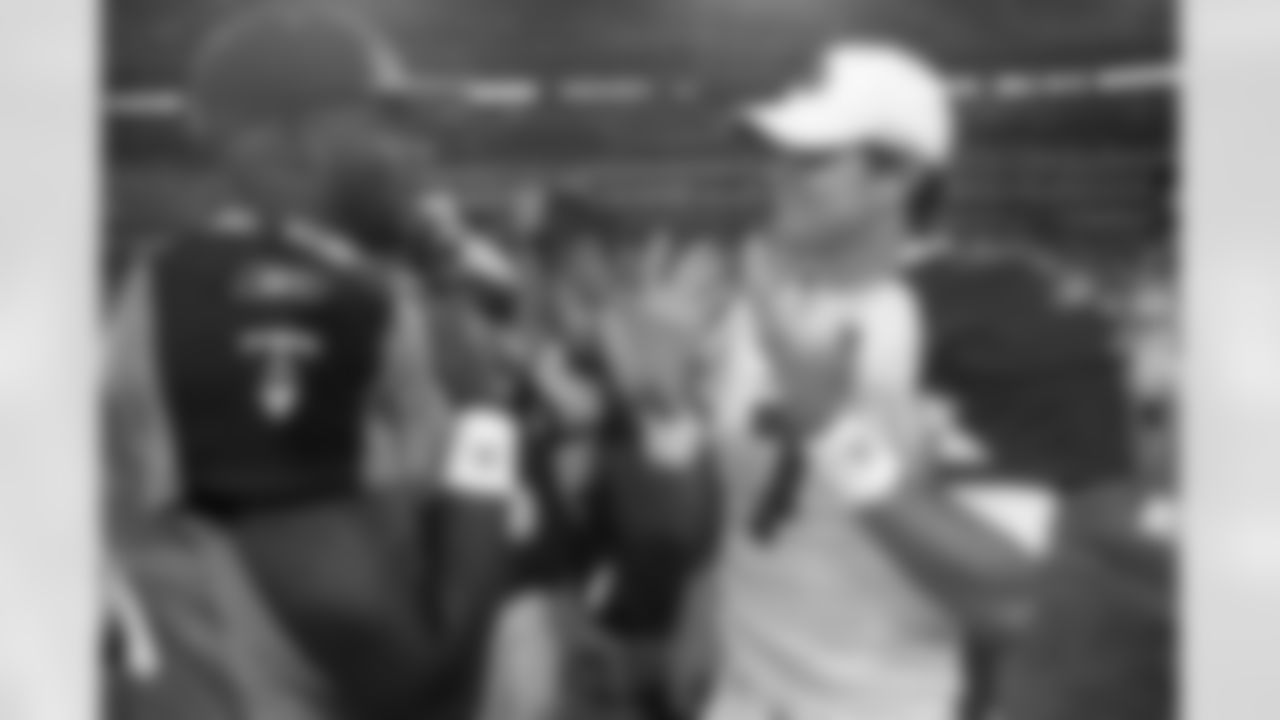 2010: Matt Leinart and Vince Young chat after a preseason game.