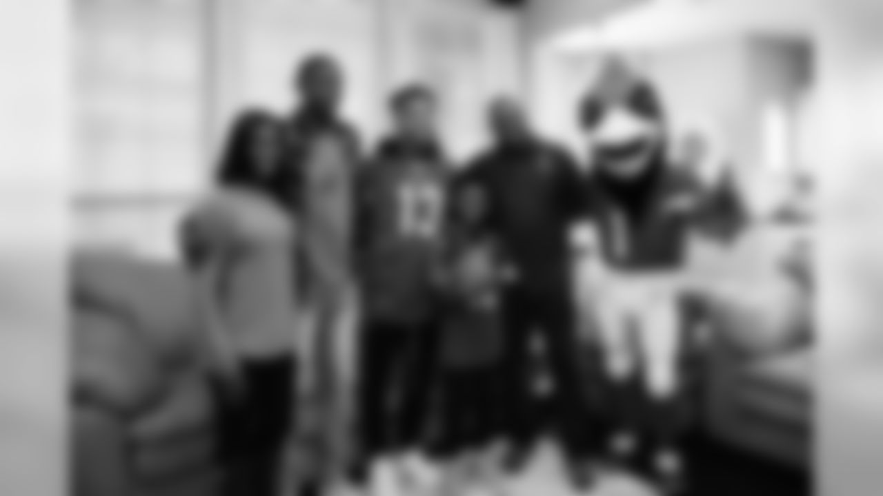 Images of Cardinals receiver Christian Kirk delivering surprise Super Bowl tickets to Devin Manigo at his home in Texas