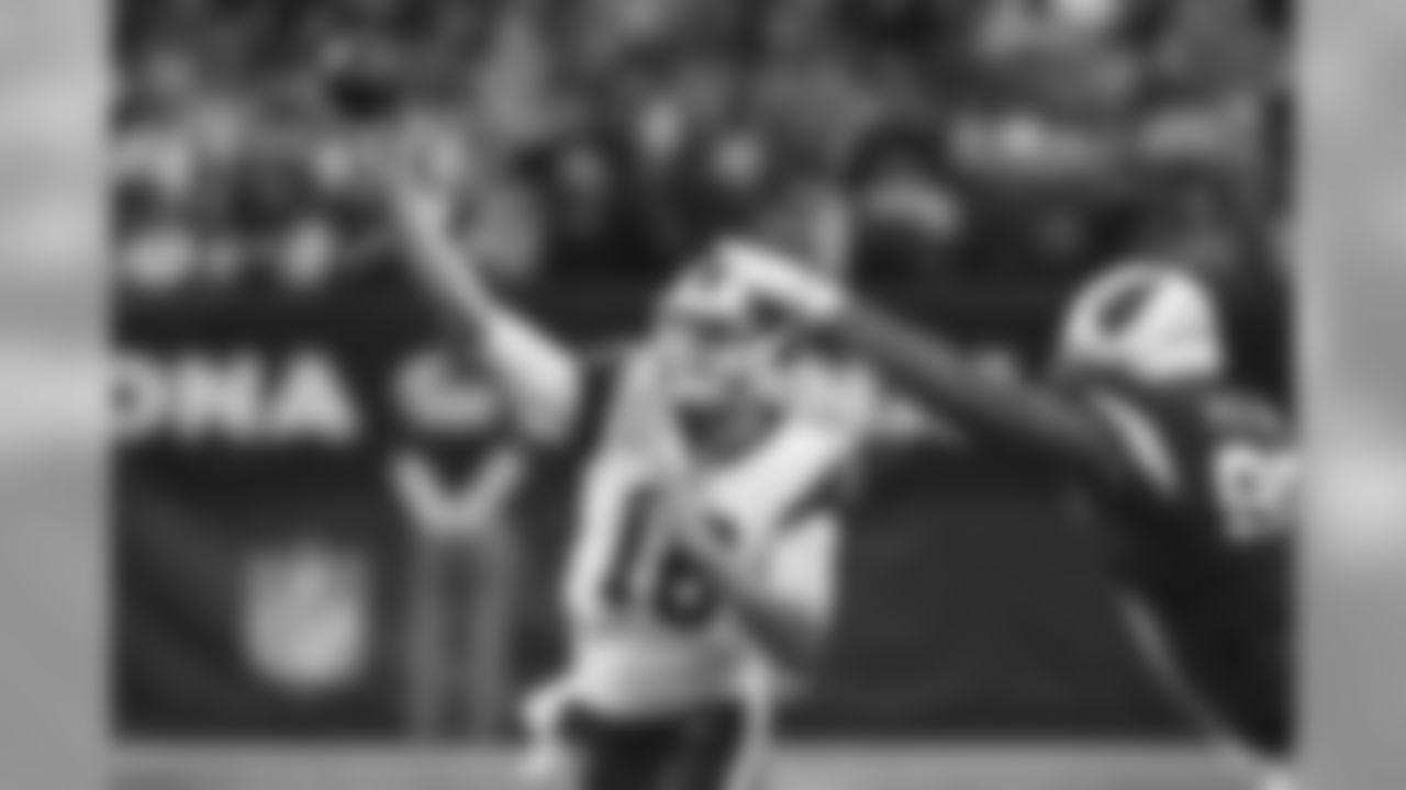 Rams quarterback Jared Goff throws against presser from Cardinals DL Corey Peters.