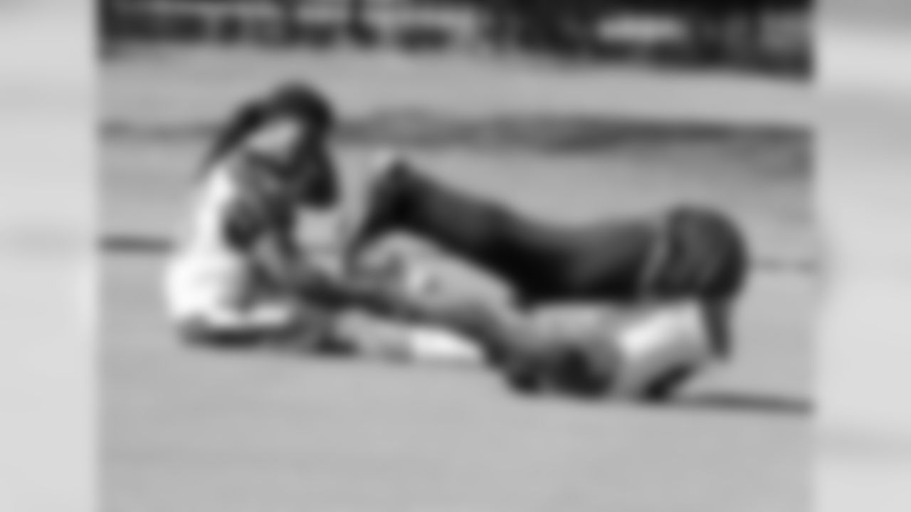 RB Andre Ellington and WR Michael Floyd stretching out