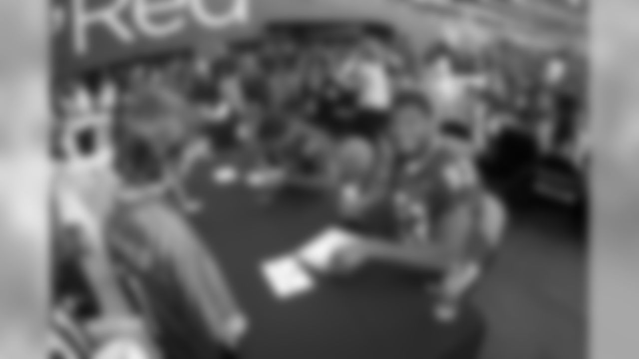 Signing autographs for the fans