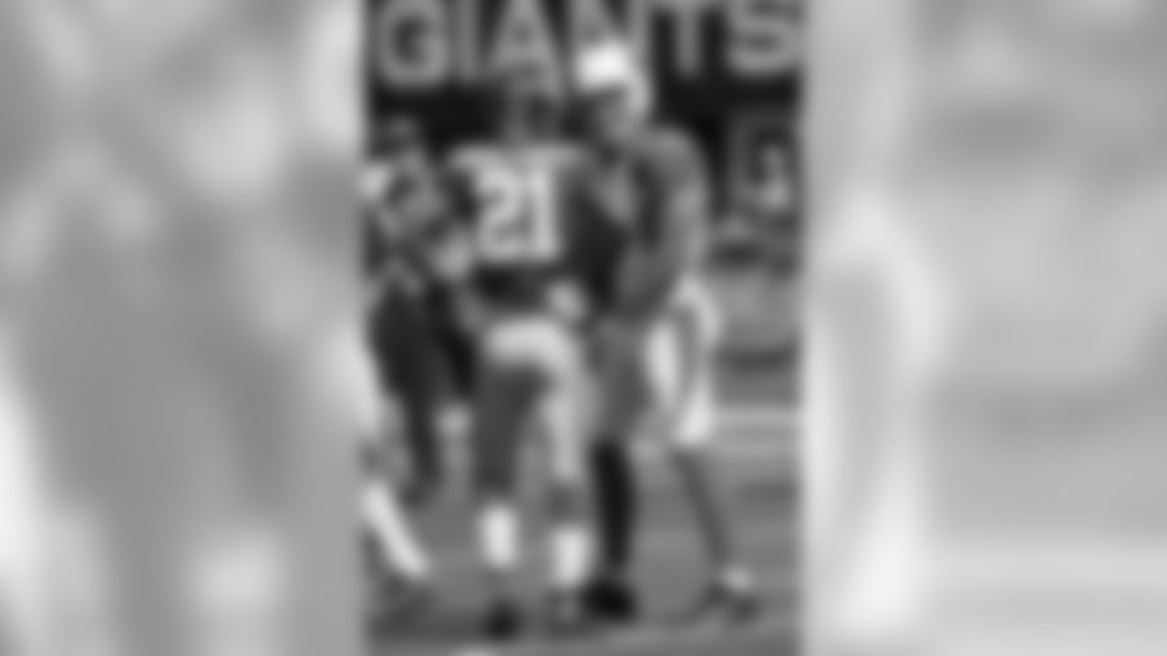 WR Larry Fitzgerald talks with former teammate Giants CB Dominique Rodgers-Cromartie