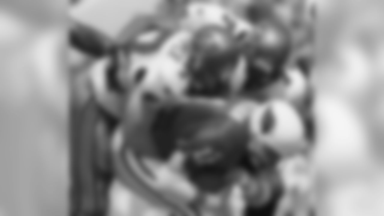 1997: QB Kent Graham is tackled by Tampa Bay's Brad Culpepper