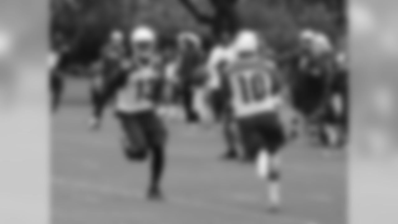 WR Jaron Brown pitches the ball to WR Brittan Golden on a reverse
