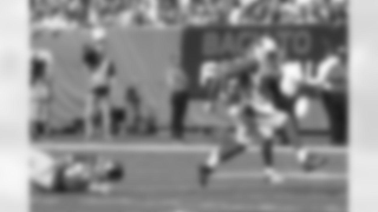 WR Ted Ginn returns a punt for a touchdown against the Giants