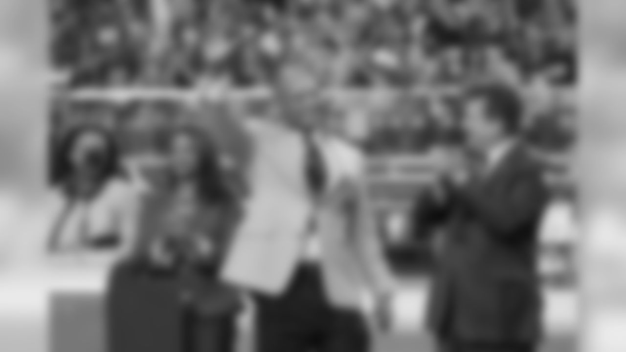Aeneas Williams waves to the crowd