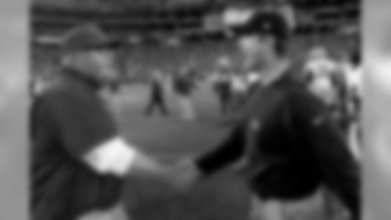 Arizona Cardinals head coach Bruce Arians, left, and San Francisco 49ers head coach Jim Harbaugh shake hands after an NFL football game Sunday, Dec. 29, 2013, in Glendale, Ariz. The 49ers won 23-20.