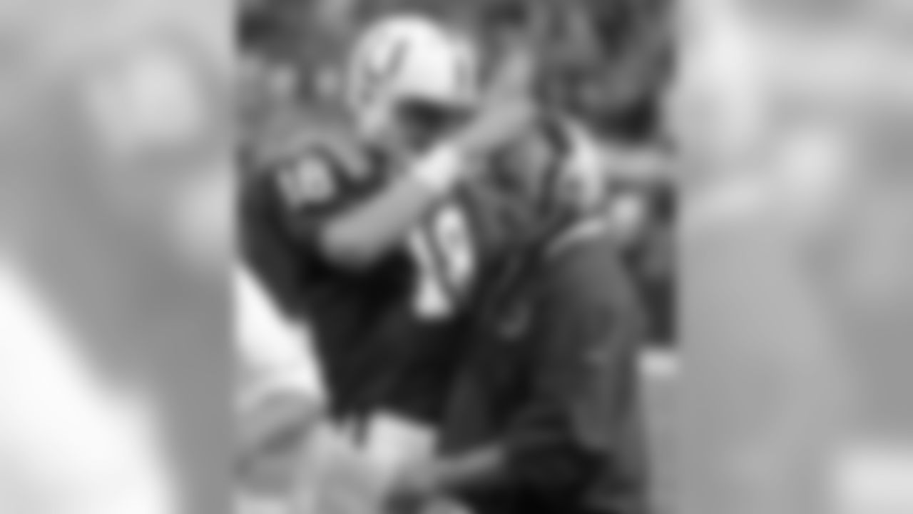 A celebratory pat on the head from Peyton Manning in 2009
