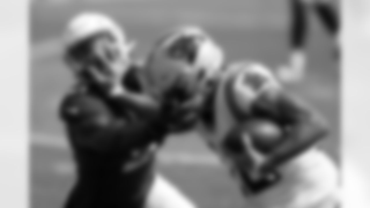 Panthers WR D.J. Moore pushes Cardinals CB Patrick Peterson.