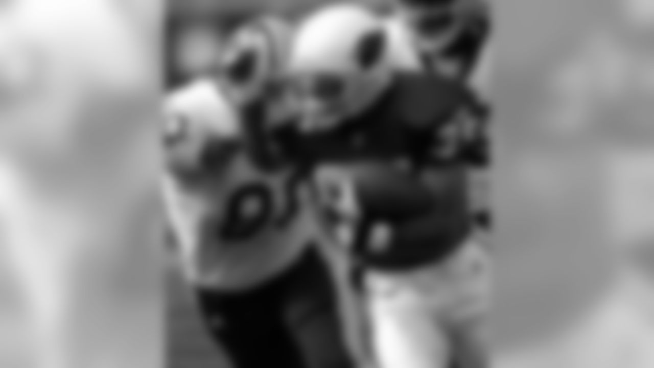 2000: CB Aeneas Williams intercepts a pass