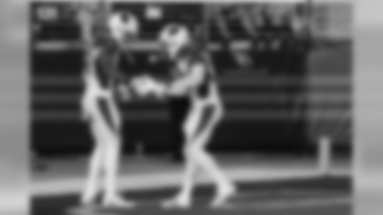 CB Marcus Cooper gets a handshake from S D.J. Swearinger after an interception against the 49ers