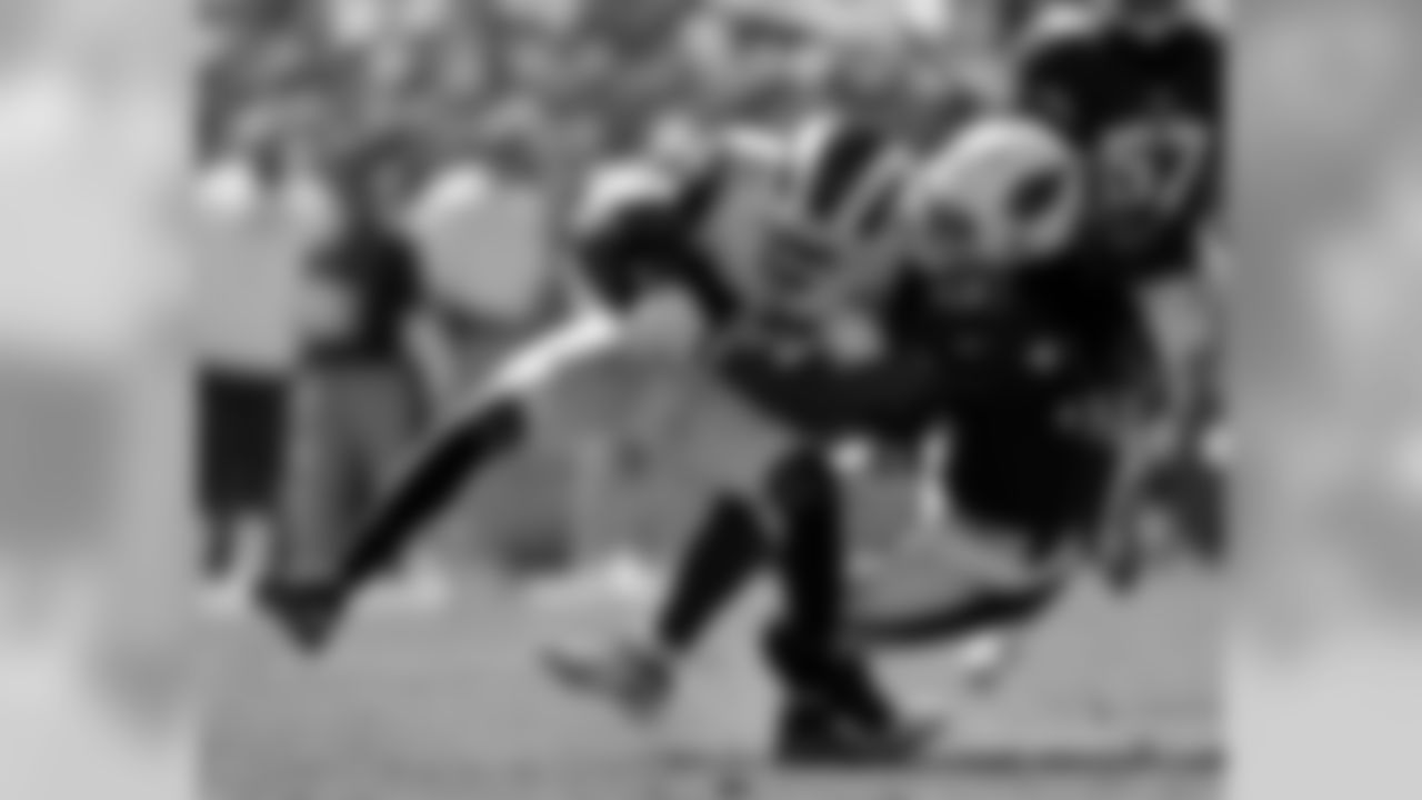 Rams wide receiver Robert Woods is tackled by Cardinals defensive back Tre Boston.