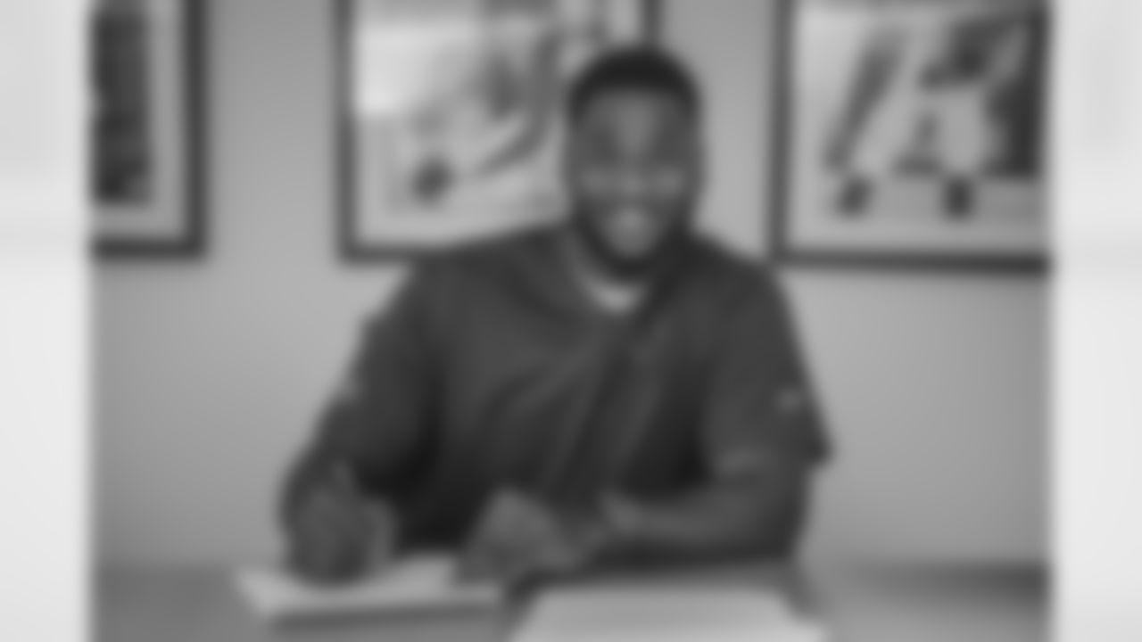 OL Haggai Chisom Ndubuisi smiles during his contract signing.