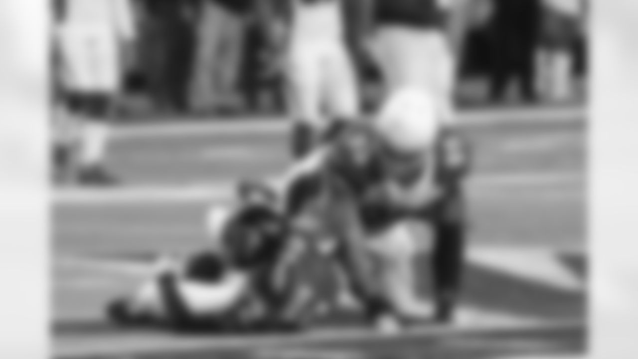 DT Tommy Kelly gets a hit on Matt Ryan