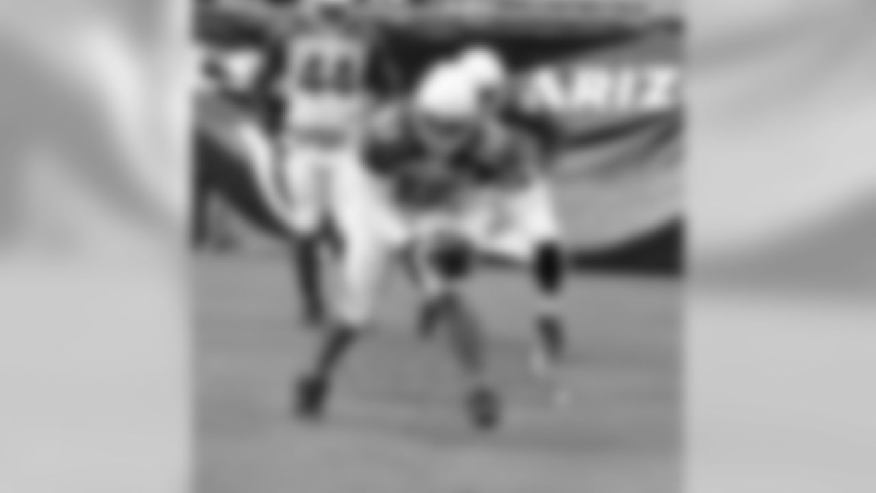 LB LaMarr Woodley scoops up a fumble in a drill