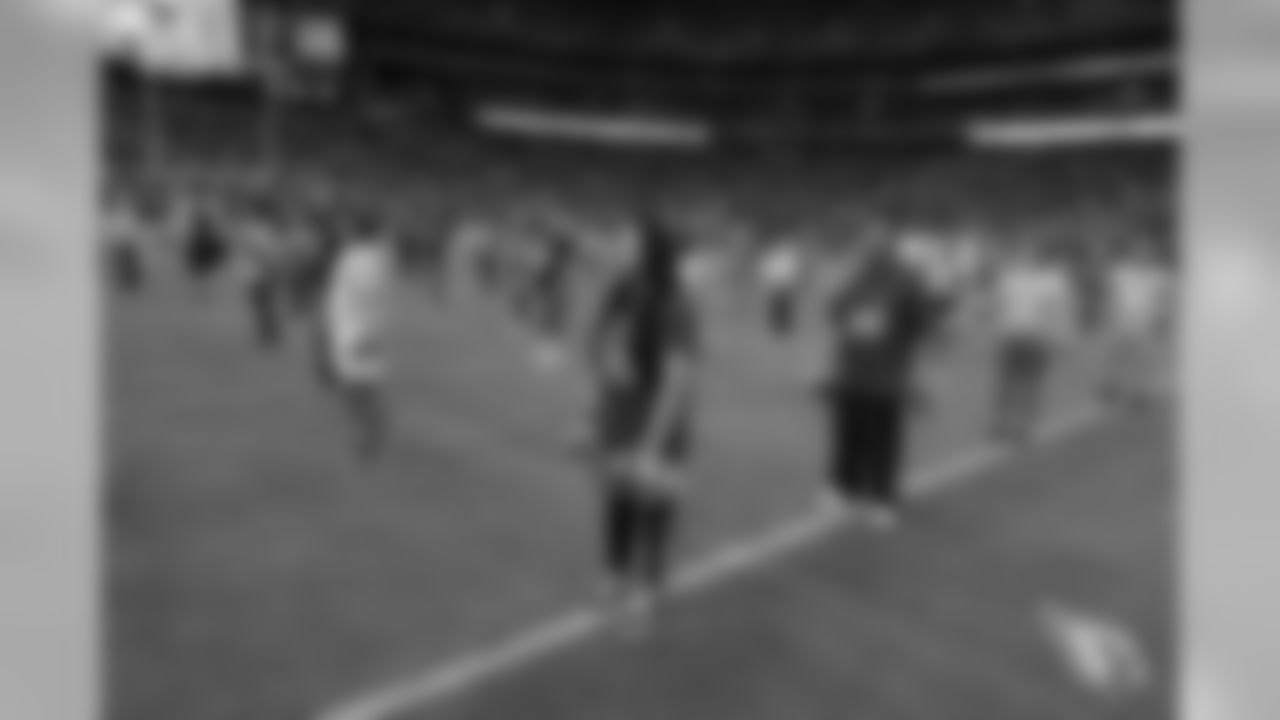 Images from halftime of the Falcons game, where Cardinals cheerleaders performed with cancer survivors and their caregivers to raise awareness for early detection and prevention