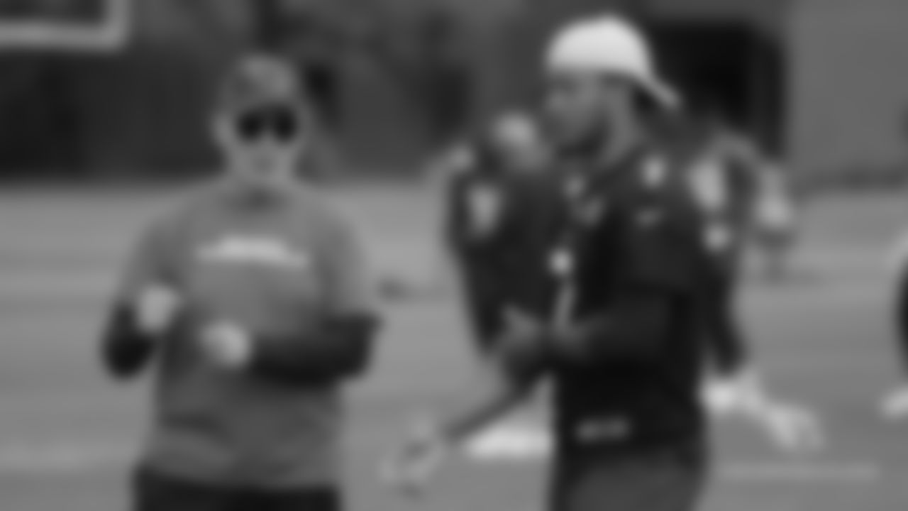Passing game coordinator Tom Clements talks to QB Brett Hundley