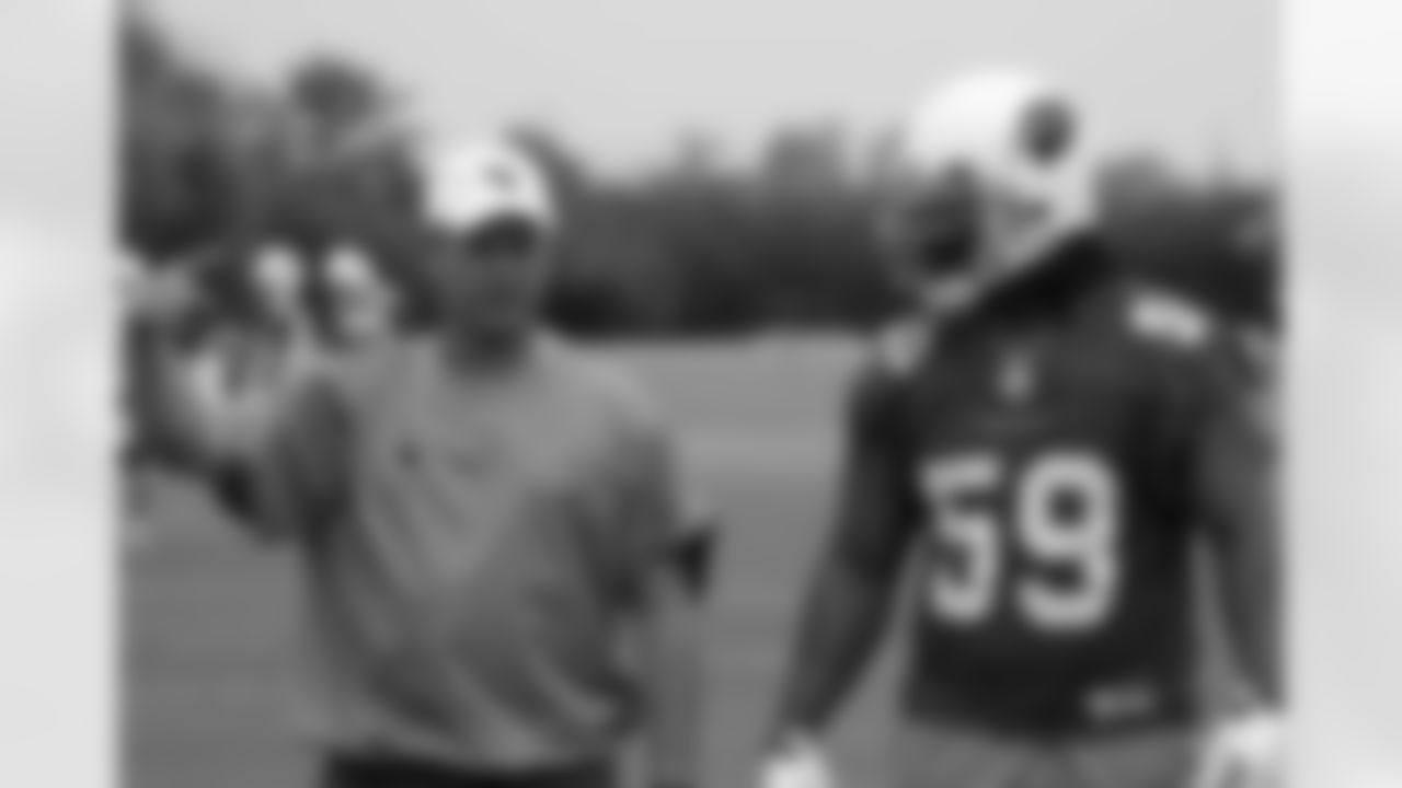 Defensive coordinator Bill Davis and rookie linebacker Will Davis