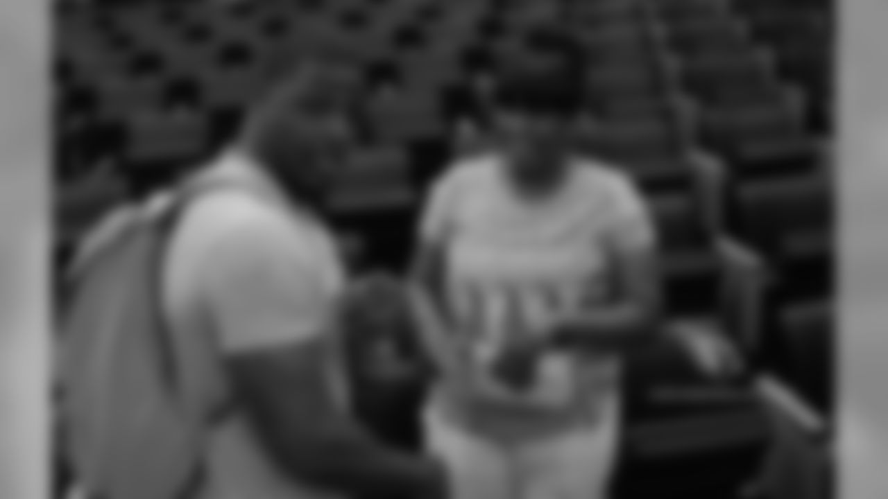 Cardinals scout Adrian Wilson talks with Reddick's mother, RaeLakia Reddick
