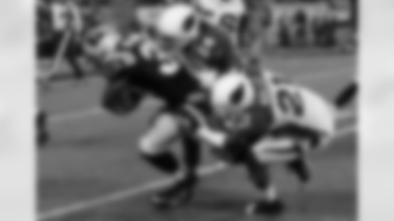 Antrel Rolle and Adrian Wilson make a stop in 2009