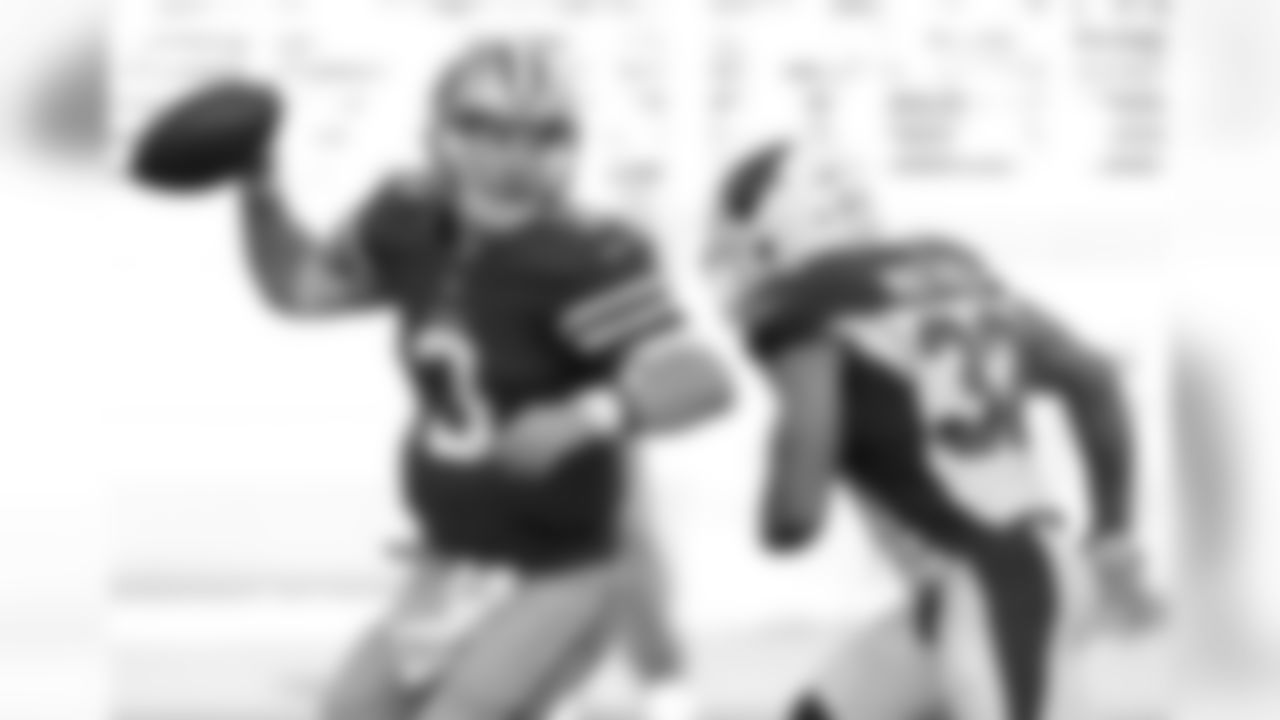 Cardinals S Tyrann Mathieu (right) pressures 49ers QB C.J. Beathard (left)