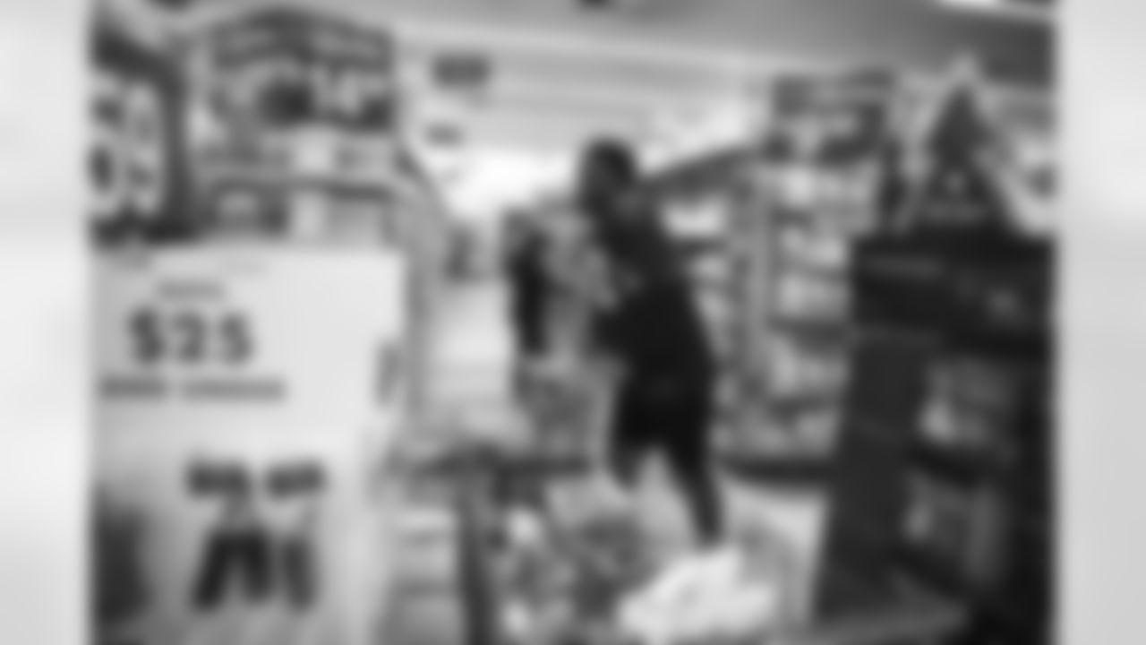 The Arizona Cardinals participate in Shop With A Jock with Desert Financial Credit Union at Walmart on Tuesday, December 13, 2022 in Tempe, AZ.