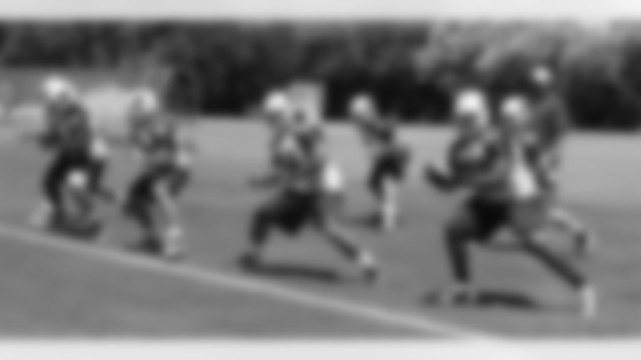 The offensive line works on pass sets