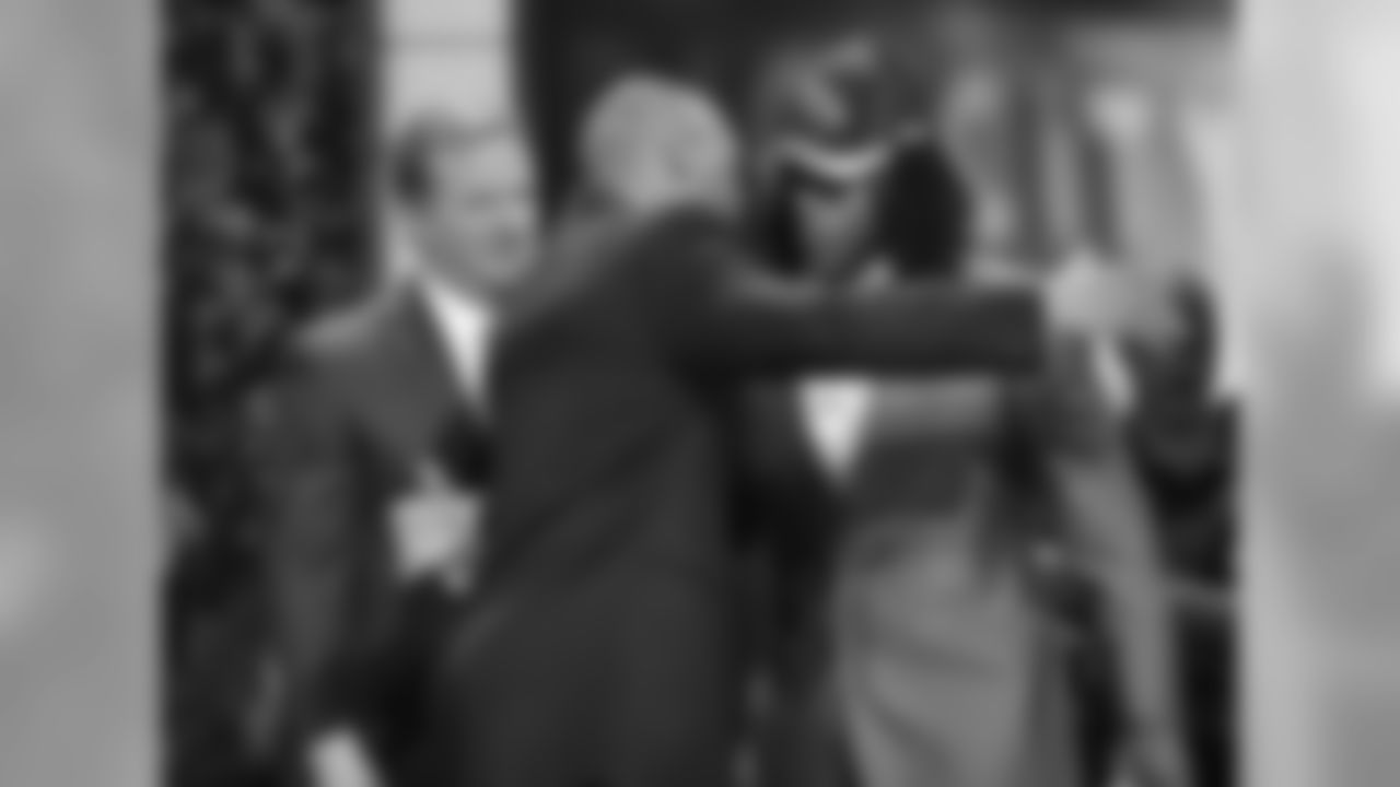 RB Ryan Williams hugs former Cardinals CB Aeneas Williams after getting chosen in the second round in 2011.