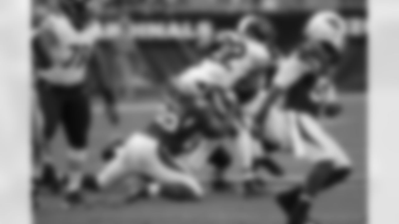 Calais tackles Matt Forte for a loss