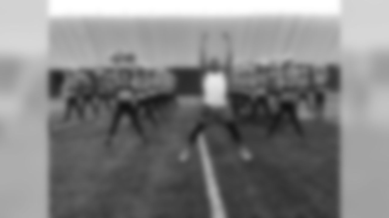 Images of the Cardinals cheerleaders practicing and performing with celebrity fitness motivator Shaun T