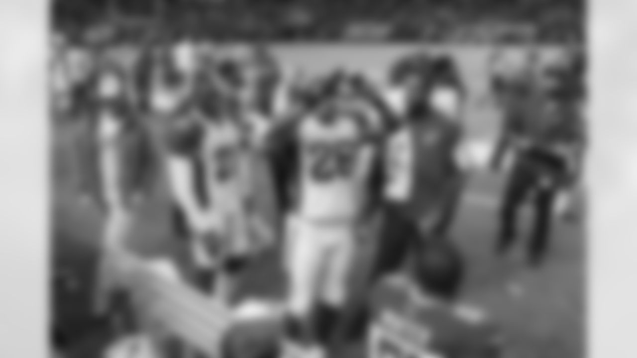 Johnson celebrates his pick six on the sideline