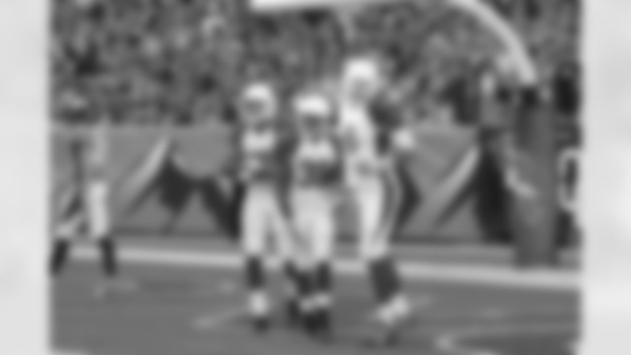 QB Logan Thomas (right) celebrates with RB Andre Ellington after an 81-yard TD
