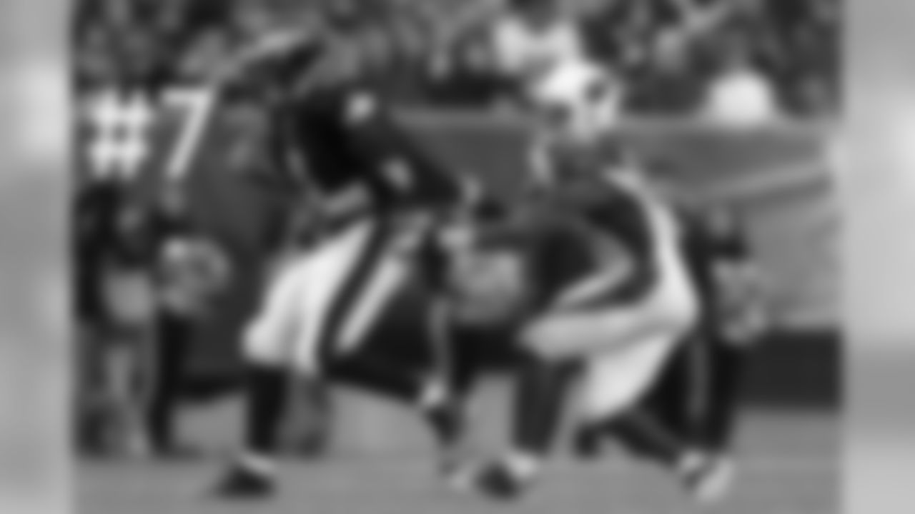 Daryl Washington grabs a hold of Nick Foles.