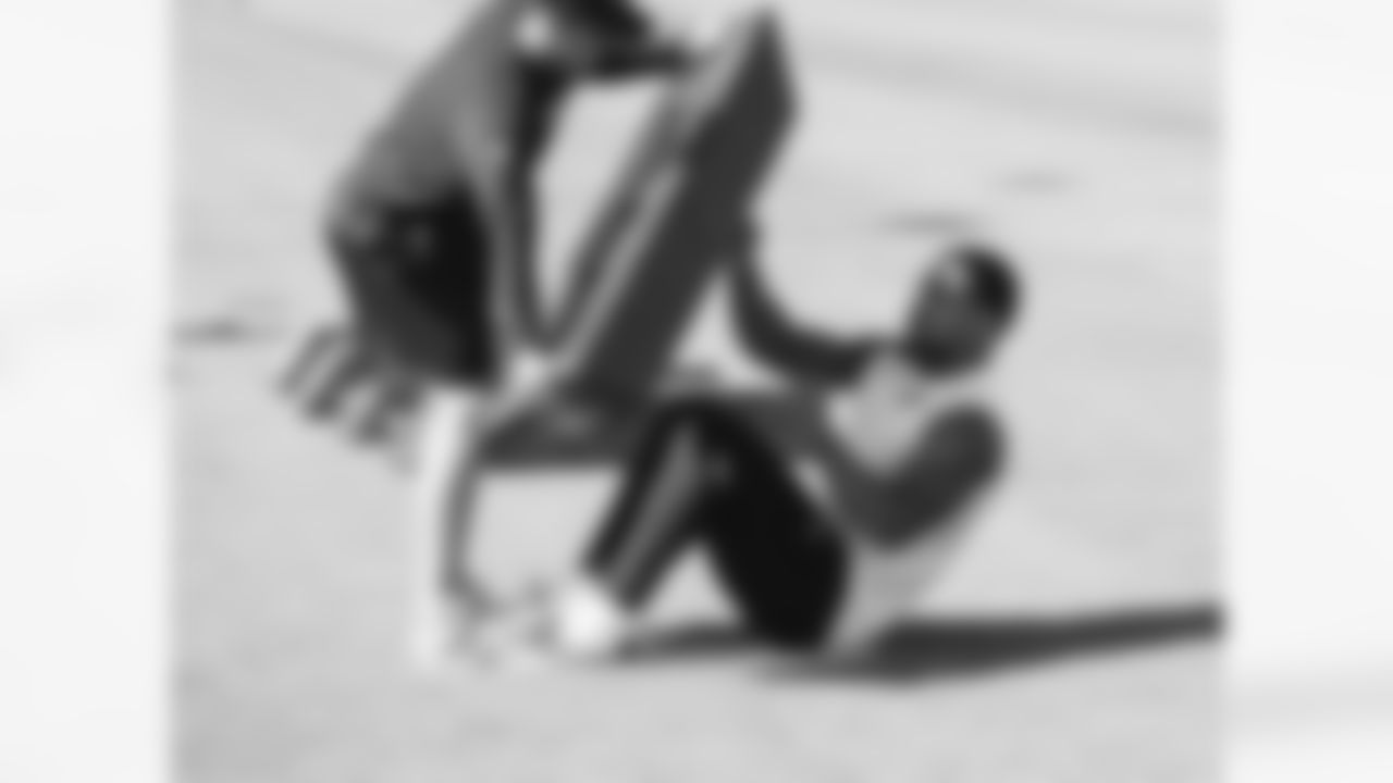 RB James Conner works with one of the Cardinals coaches.