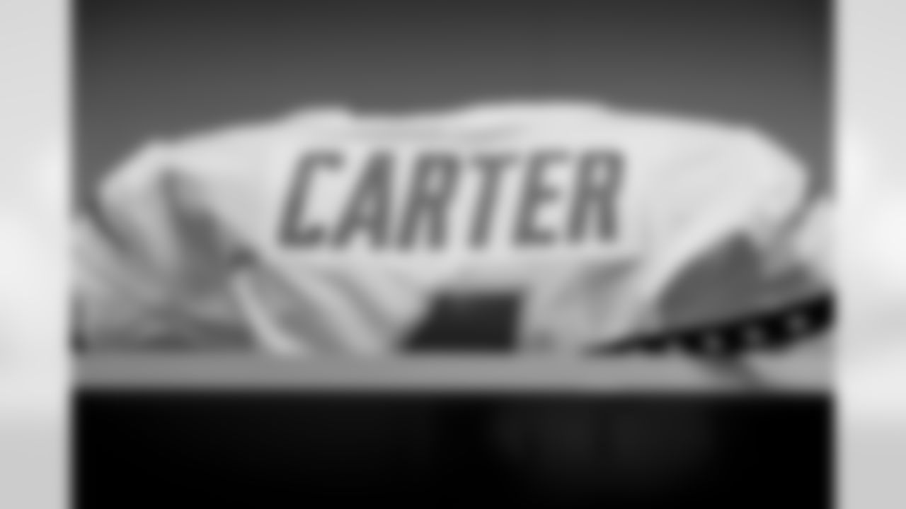 The Los Angeles Chargers prepare to play against the Arizona Cardinals at State Farm Stadium on November 27, 2022 in Glendale, Arizona.
