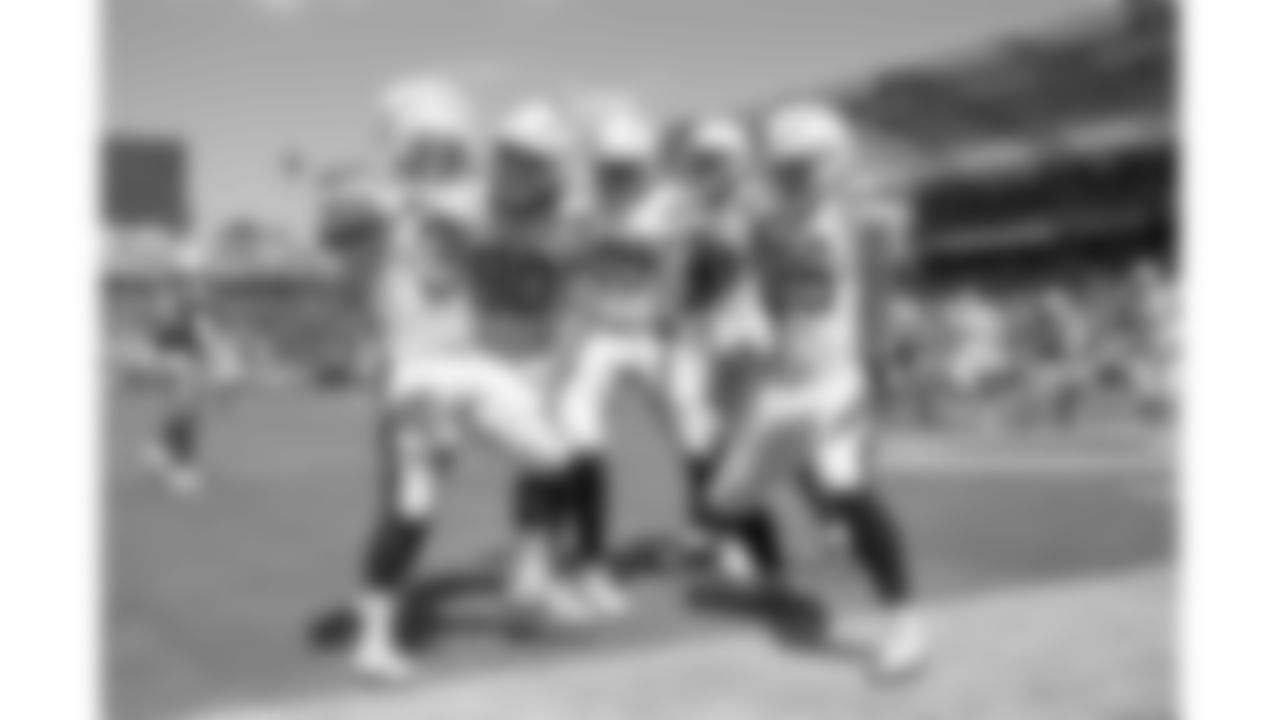 Hat Trick – This shot after one of Austin Ekeler's three scores from the season opener shows how excited his teammates were for him. I love how Hunter Henry is even 'playing guitar' like Ekeler does in his TD celebrations. - Mike Nowak/Los Angeles Chargers