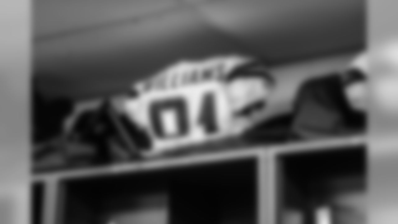 Mike Williams' jersey sits in the locker room before the Divisional Round matchup against the New England Patriots at Gillette Stadium.