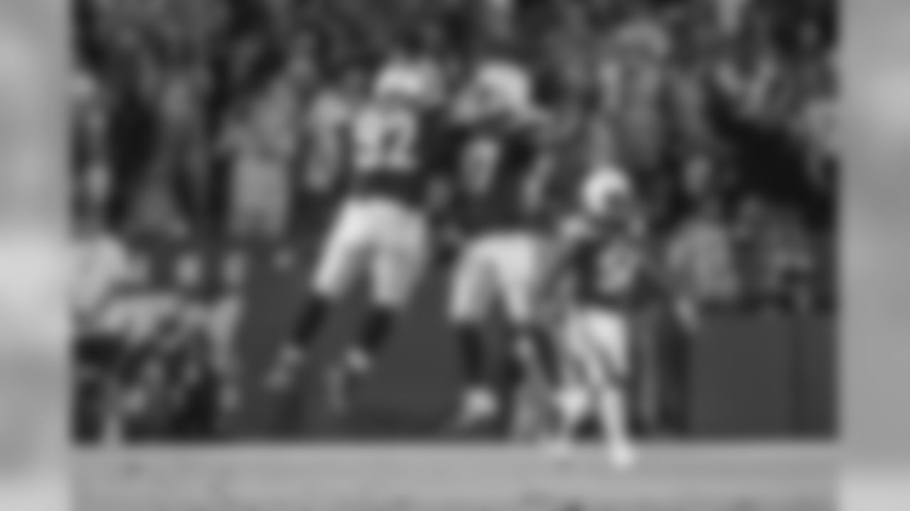 Brandon Mebane and Jatavis Brown celebrate during the Chargers' preseason home opener against the Seattle Seahawks at ROKiT Field at StubHub Center.