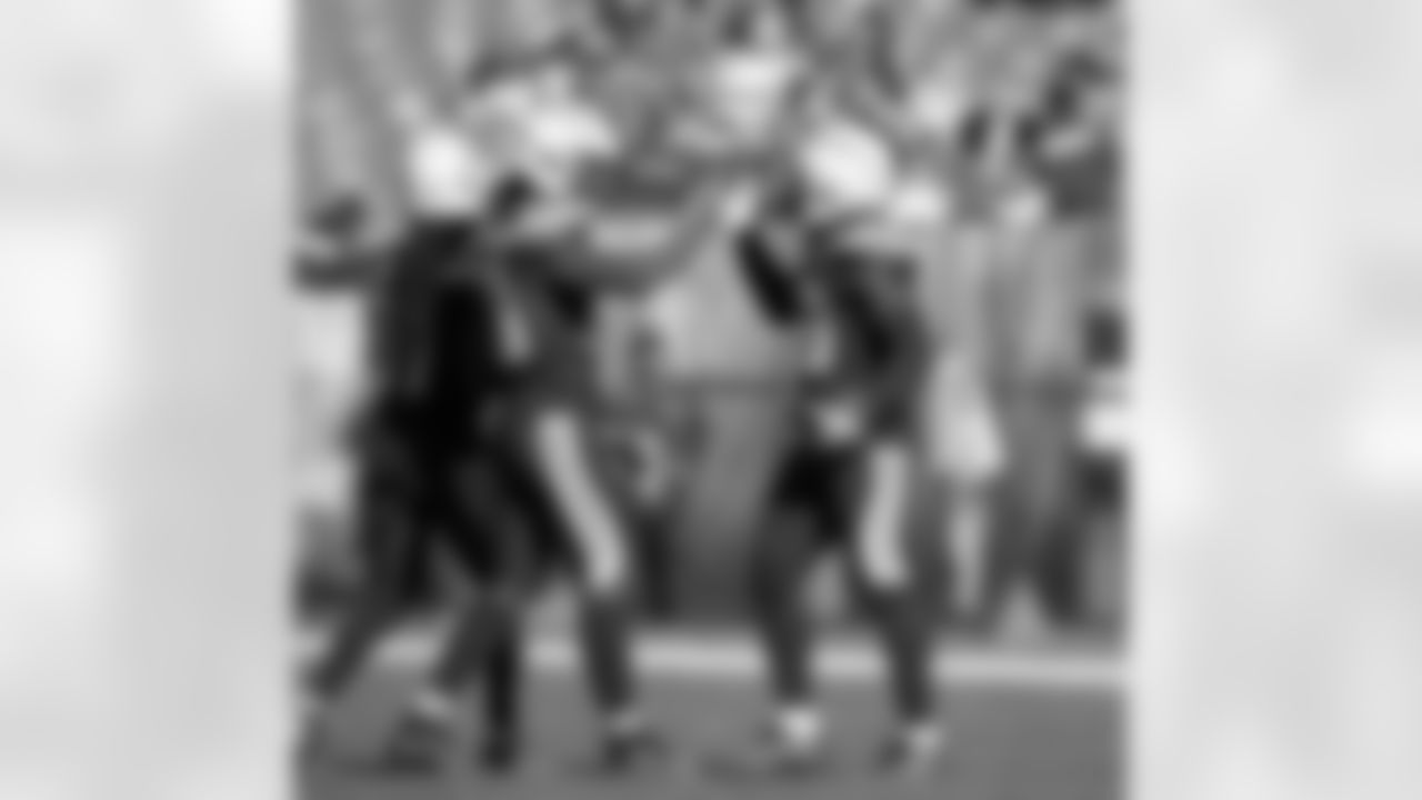Rayshawn Jenkins high fives Demond King after King's second interception of the day during the Week 6 matchup against the Cleveland Browns.