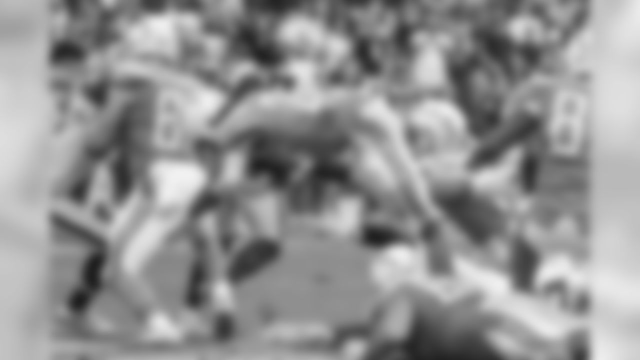 Melvin Gordon dives over defenders during the Bolts' Week 5 matchup against the Oakland Raiders at ROKiT Field at StubHub Center.