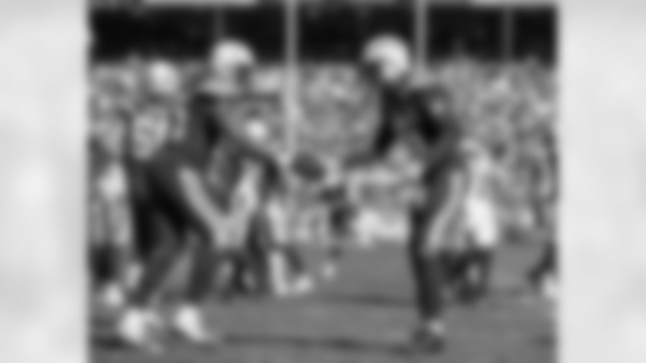 Antonio Gates and Tyrell Williams slap hands on the field during the Week 6 matchup against the Cleveland Browns.