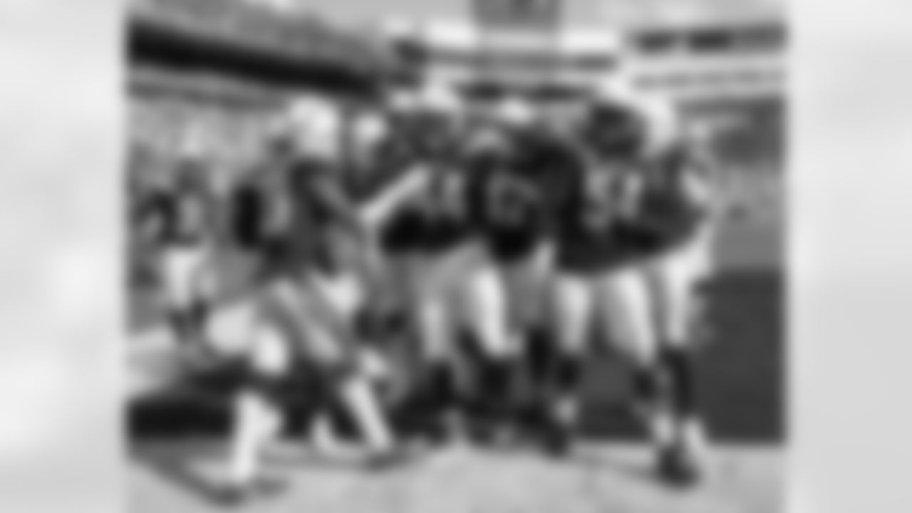 The Bolts celebrate Kyzir White's first NFL interception during the Chargers' Week 2 game against the Buffalo Bills at New Era Field.