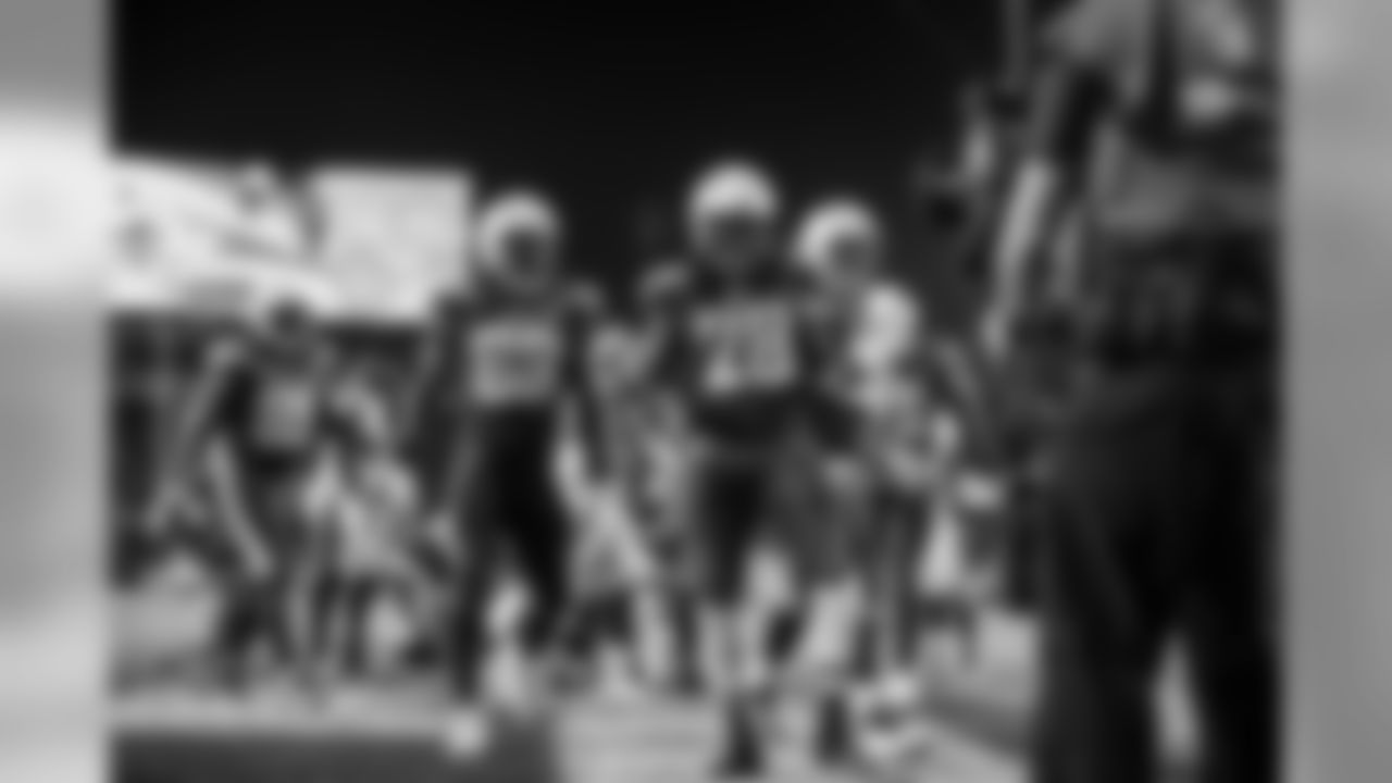 Melvin Gordon celebrates his touchdown during the Week 16 matchup against the Baltimore Ravens at ROKiT Field at StubHub Center.