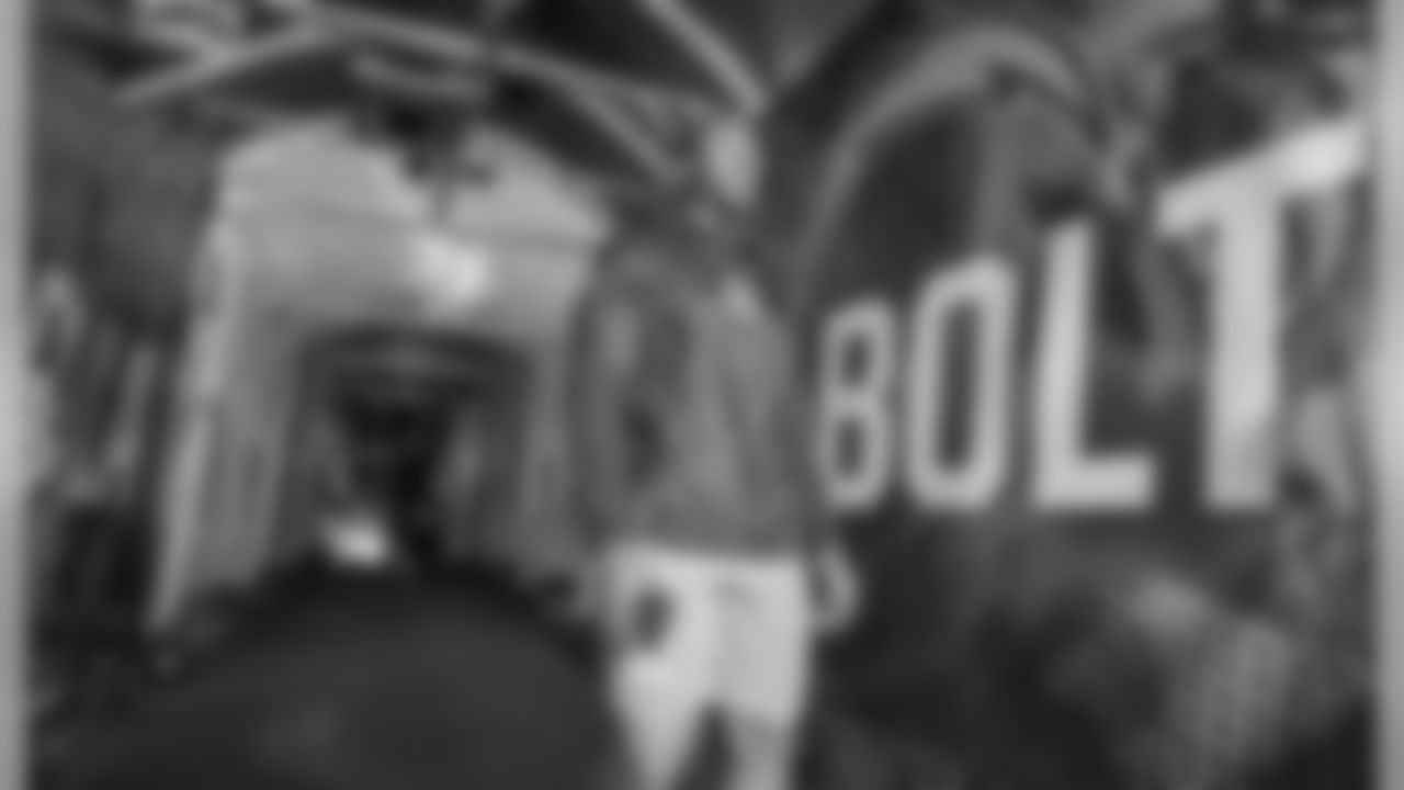 Uchenna Nwosu walks through the tunnel out to the field to warm up before the Week 11 contest against the Denver Broncos.