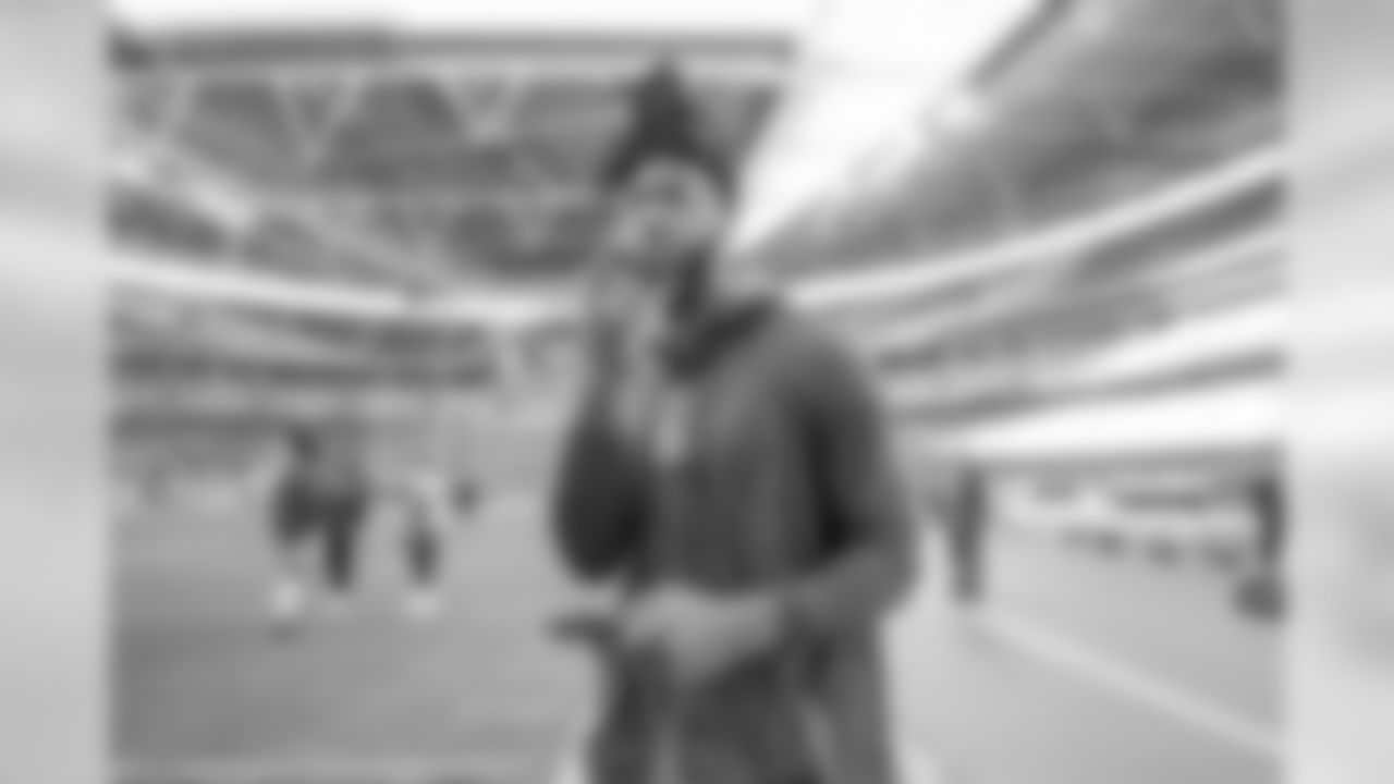 Mike Williams walks out to warm up at Wembley Stadium in London before the Week 7 matchup against the Tennessee Titans.