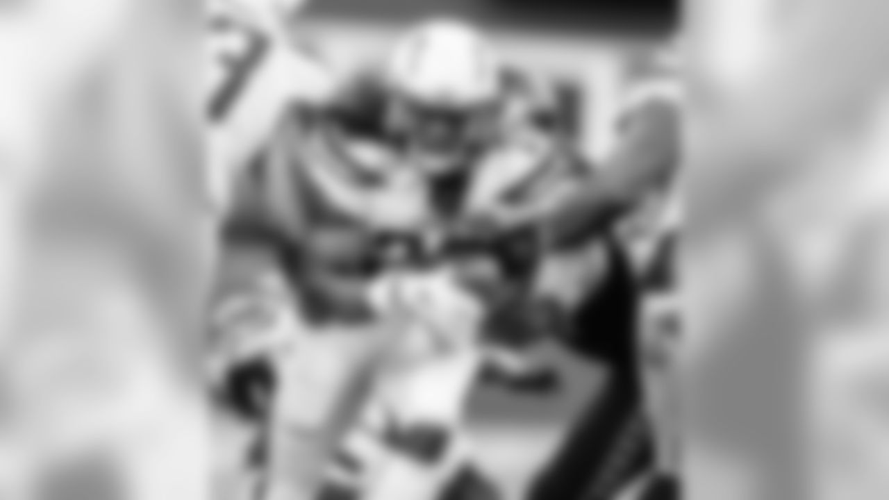 Melvin Gordon breaking through a Seattle Seahawks defensive player's tackle at CenturyLink Field on Sunday, November 4, 2018.
